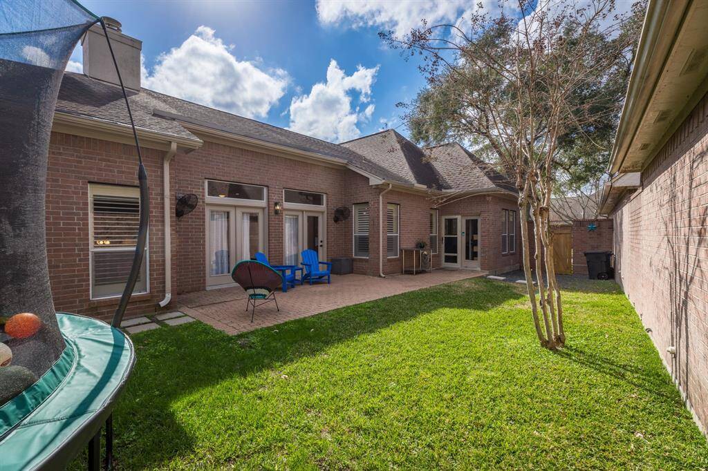 Love this big back yard. Double french doors open to living area.