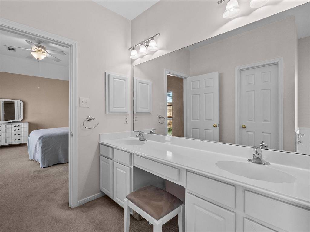 Double sink vanity in primary suite.