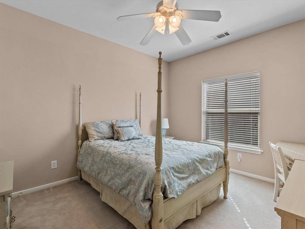 Another spacious secondary bedroom with a walk-in closet, offering plenty of storage space.