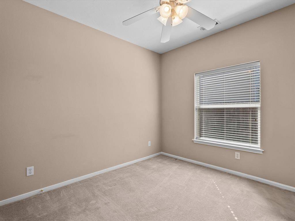 Last of the three secondary bedrooms offering plenty of space and closet storage.