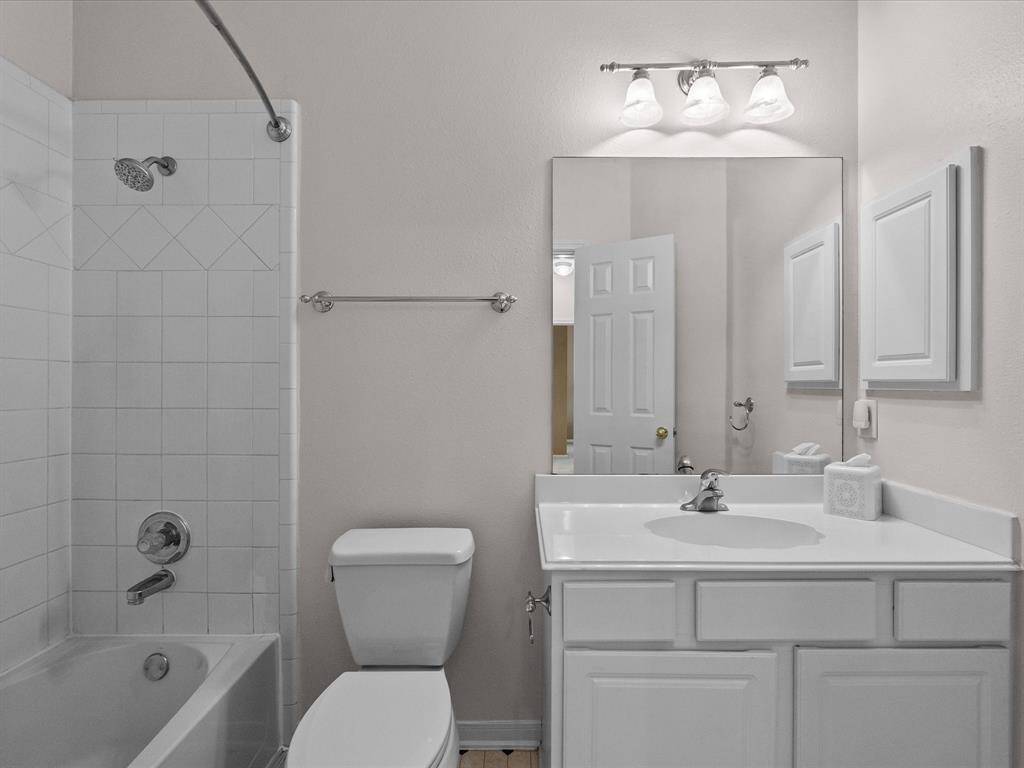 Fresh secondary bath off hallway.