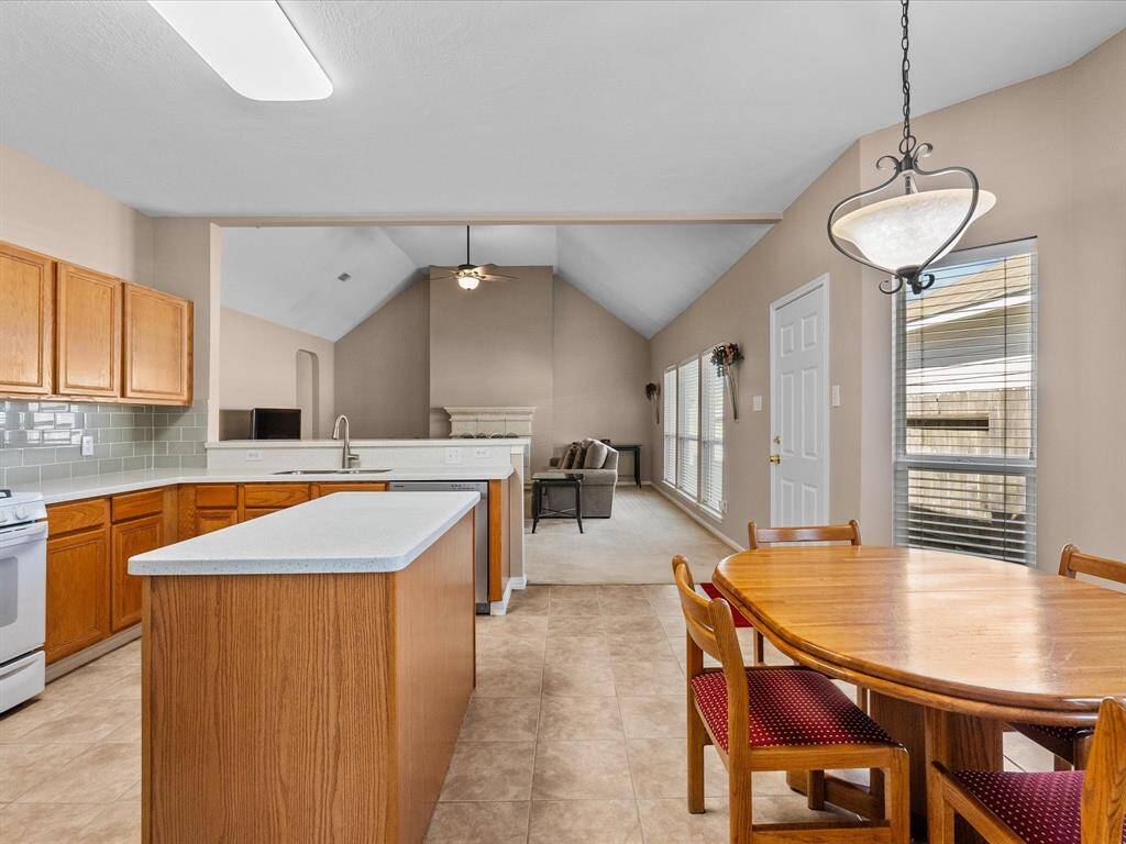 Spacious island kitchen featuring a bay-window breakfast nook, perfect for enjoying natural light.