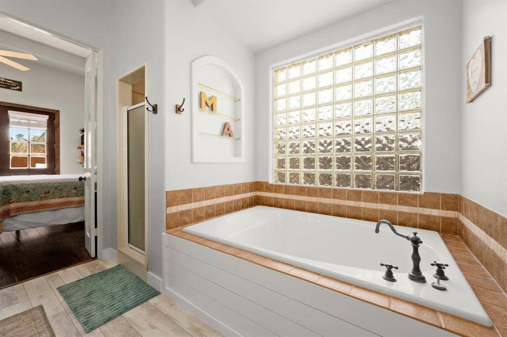 Soaker tub and separate shower.