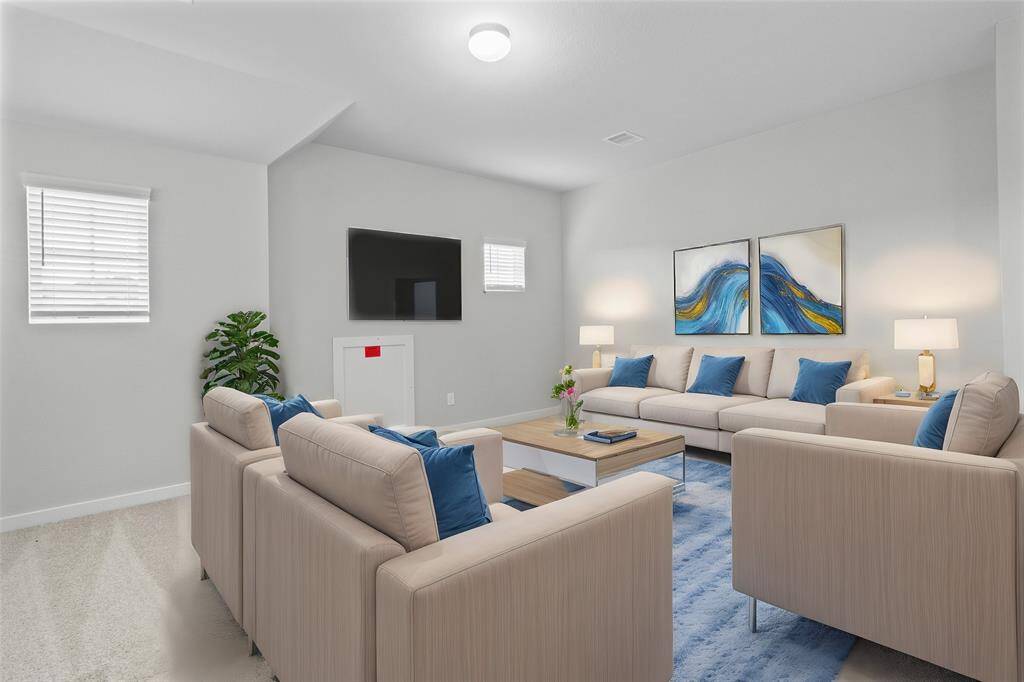 Come upstairs and enjoy a day of leisure in this fabulous game room/media room!!!  This is the perfect hangout spot or adult game room, this space features plush carpet, high vaulted ceiling, recessed lighting, and custom paint!