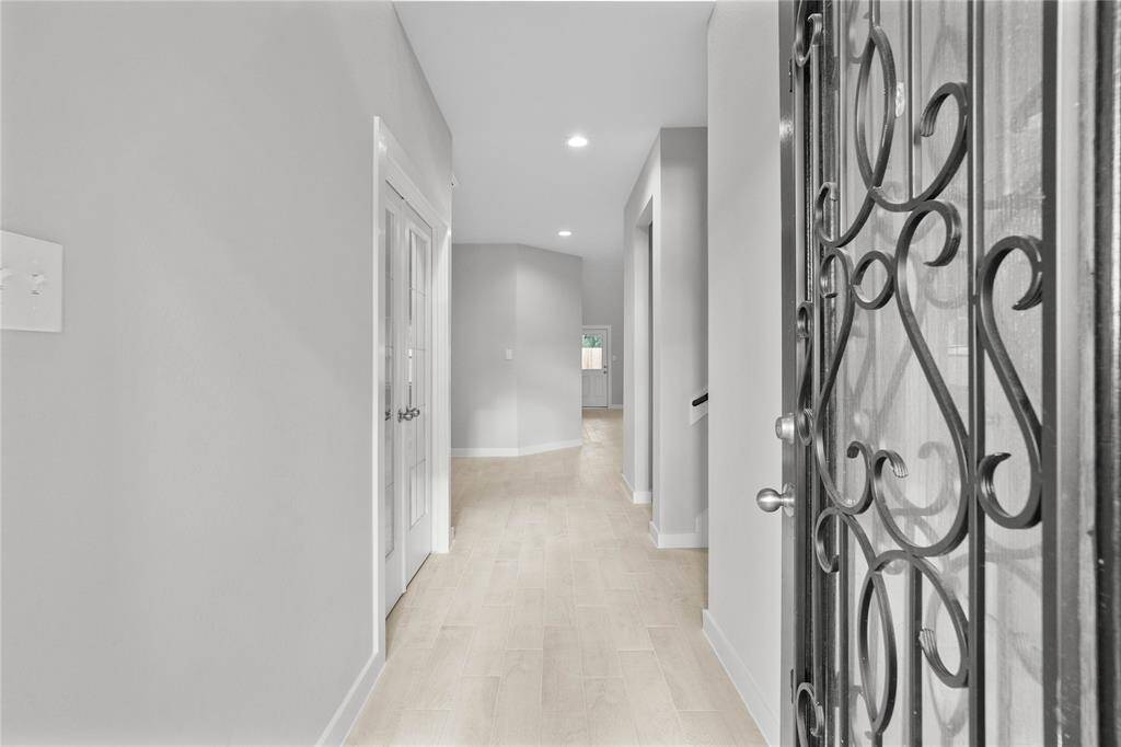 Welcome home to 18219 Windy Knoll Way. You are greeted by this ornate front door and gorgeous entryway!