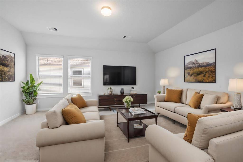 This spacious and bright game room features custom paint with gorgeous plush carpet, and large windows with privacy blinds! With the ample amount of space provided, you can turn this area into anything! From a media room to a children's play room, the possibilities are endless!
