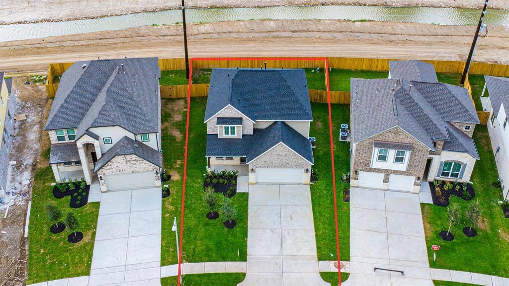 This home sits on a large lot with ample yard space in front and the back, lush landscaping and well-maintained yard!
