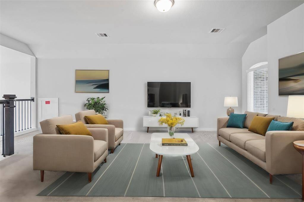 Come upstairs and enjoy a day of leisure in this fabulous game room! This is the perfect hangout spot or adult game room, this space features plush carpet, high ceiling, lighting and custom paint.