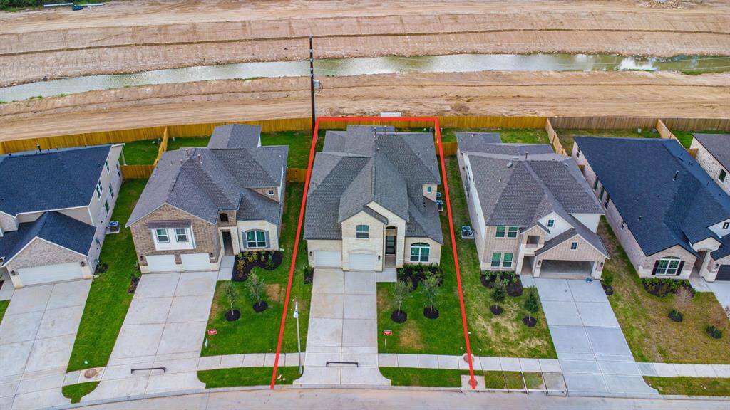 This home sits on a large lot with NO REAR NEIGHBOR. There is ample yard space in front and the back, lush landscaping and a well-maintained yard.