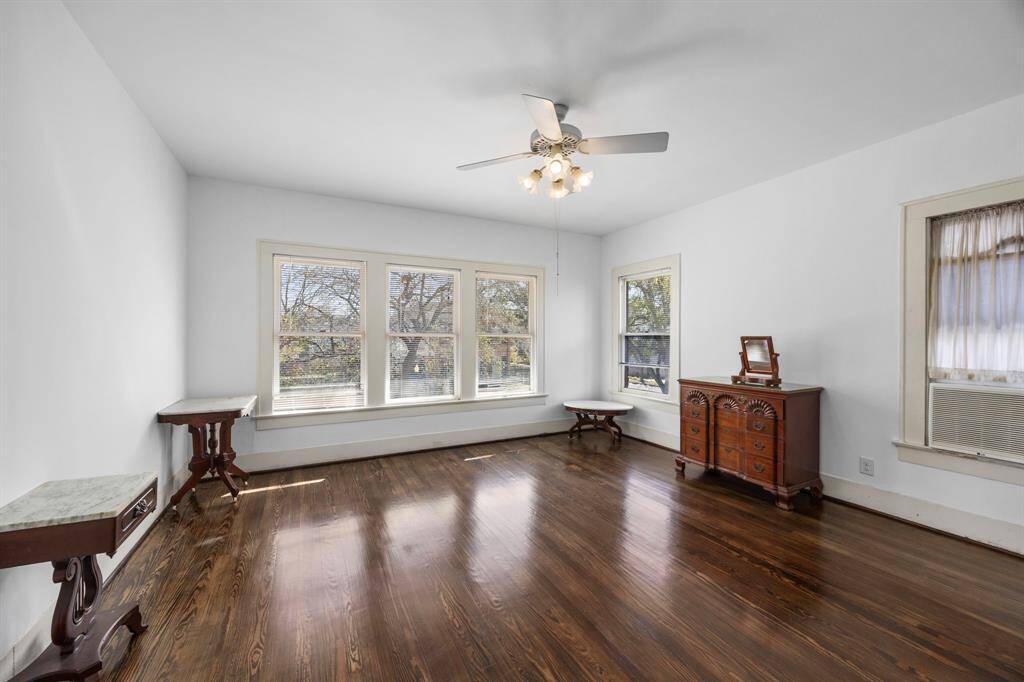 Bright and spacious upstairs bedroom with abundant natural light. All upstairs bedrooms are generously sized.