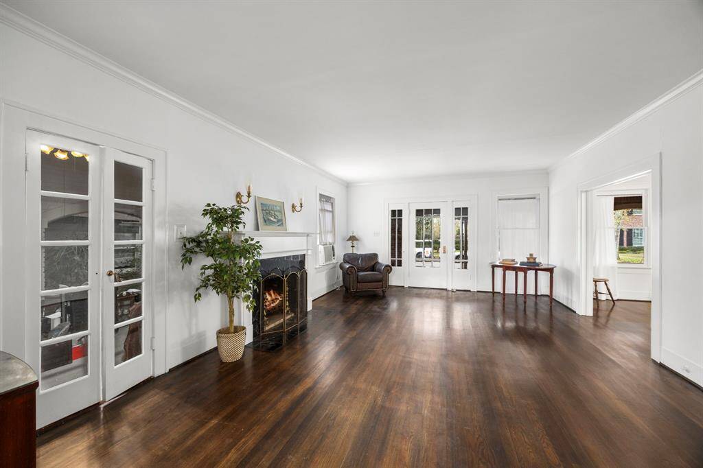 This spacious historic home boasts hardwood floors, charming French doors, and a cozy fireplace, offering the perfect canvas for buyers looking to restore its classic elegance or reimagine it with a more modern twist. *Fireplace digitally added. Gas fireplace. Currently capped.