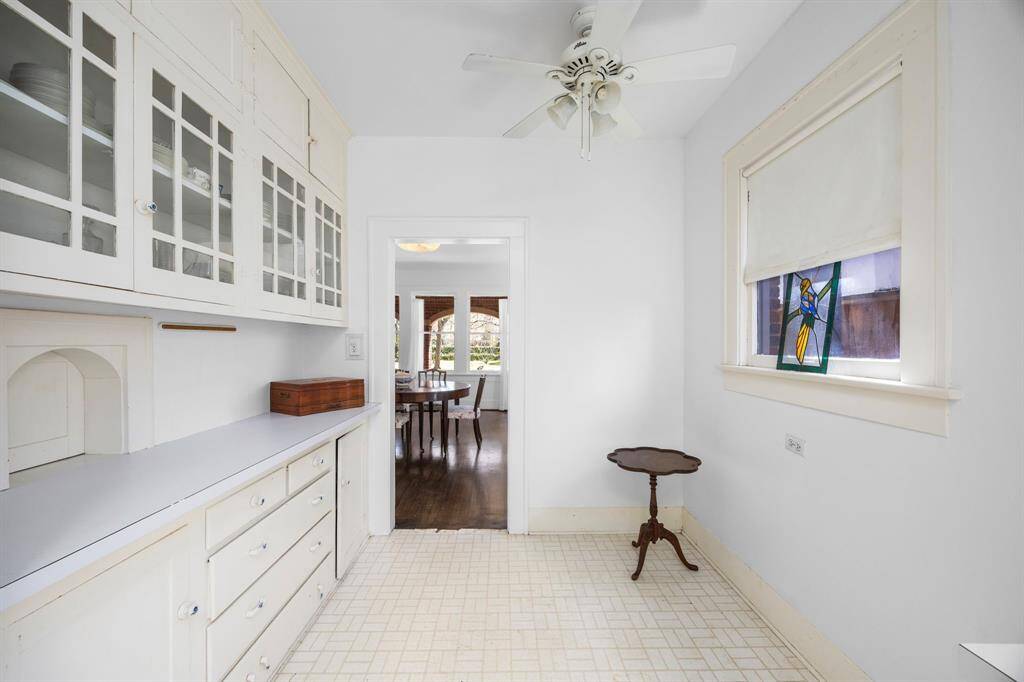 Another angle of the kitchen with potential for open-concept living by removing the wall to the dining room.