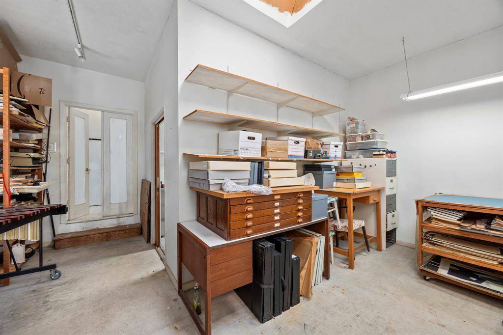 This spacious room located at the back of the house is ideal for a home office or workshop. It features overhead lighting and a clean layout, perfect for organizing your projects or supplies. Can be converted into a future primary bedroom suite or a 4th guest bedroom.