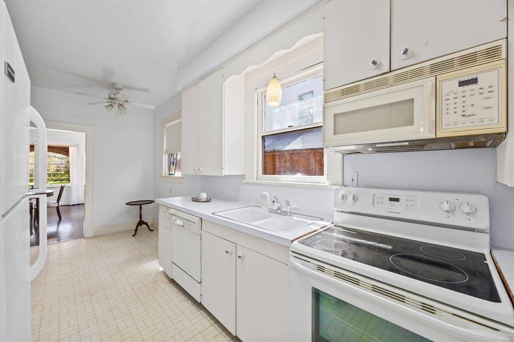 Bright and airy kitchen with abundant natural light. Fully gut and reconfigure the kitchen with a large island facing the living room.
