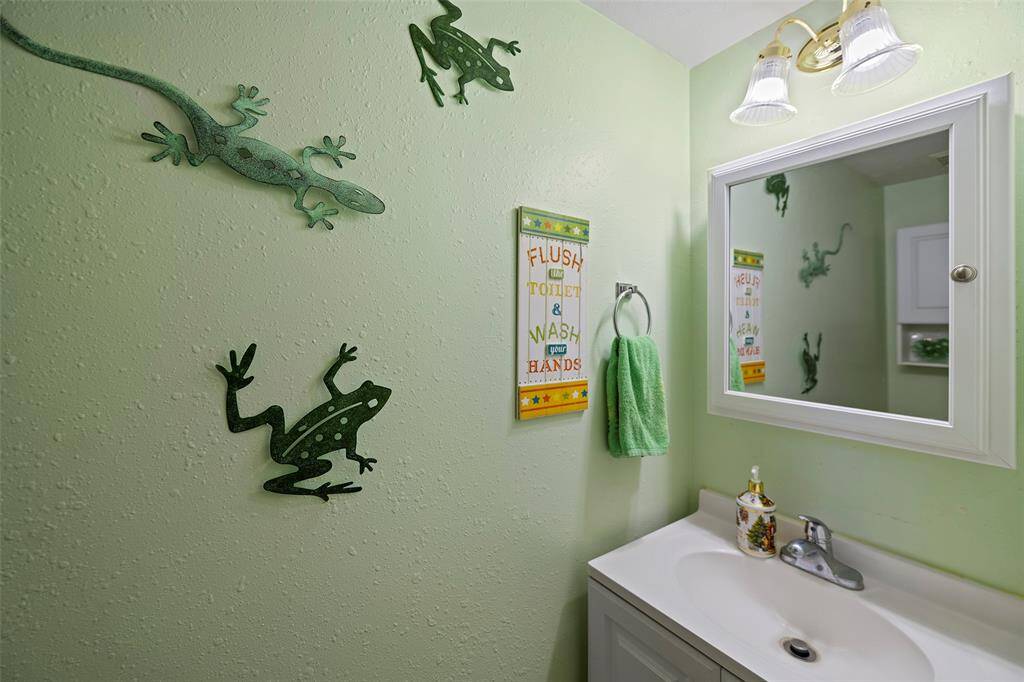 A quaint powder bath offers a place for guests and residents to freshen up during a visit!