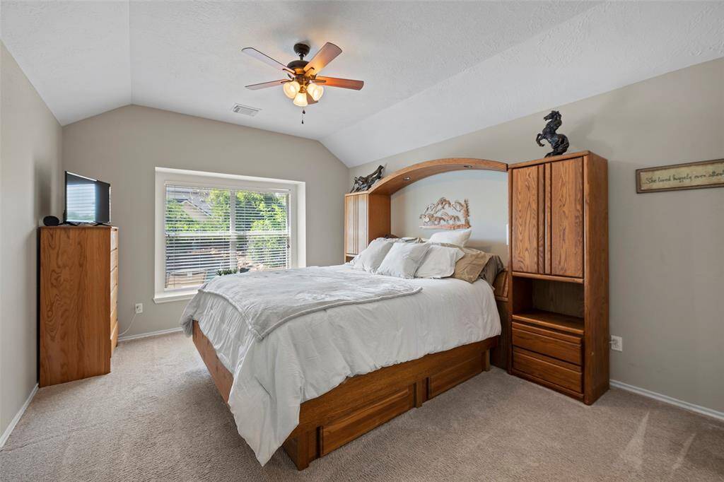 A serene primary suite awaits you to settle in and enjoy a peaceful slumber!  A cozy window seat is perfect for sitting and reading a good book with amazing sunlight!