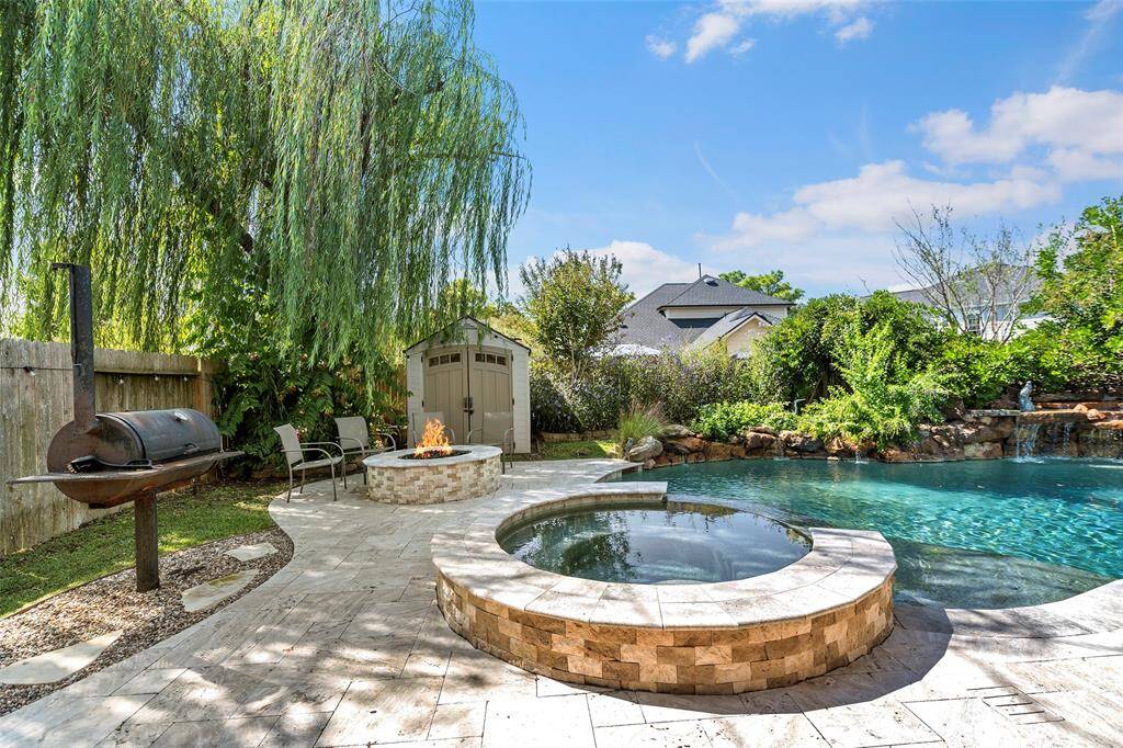 This awesome outdoor entertaining space is ready for you to enjoy having backyard BBQ's or evenings by the firepit roasting marshmallows with friends!