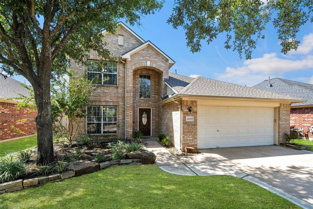 A meticulously maintained front yard shows how much pride in ownership and care has been put into this wonderful home!