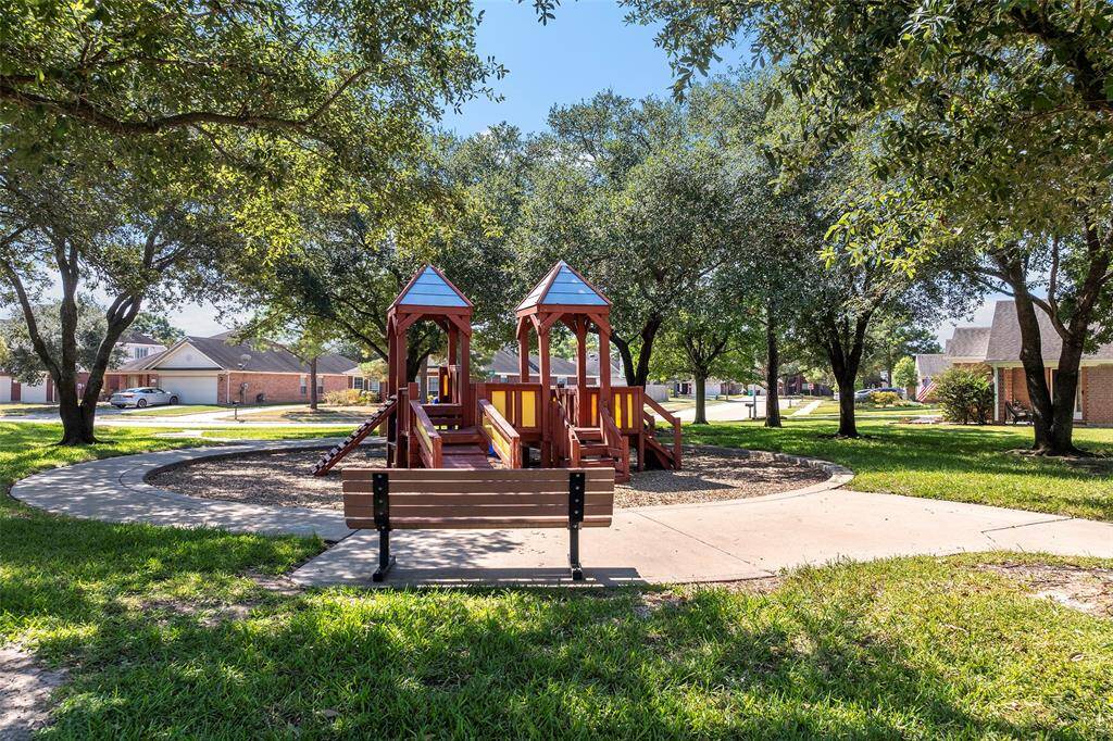A quick stroll and you'll find a neighborhood park surrounded by shade trees!