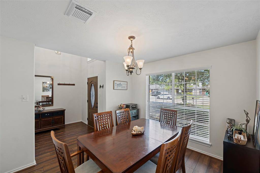Just off the entry is the formal dining room with large picture window overlooking the front yard space!