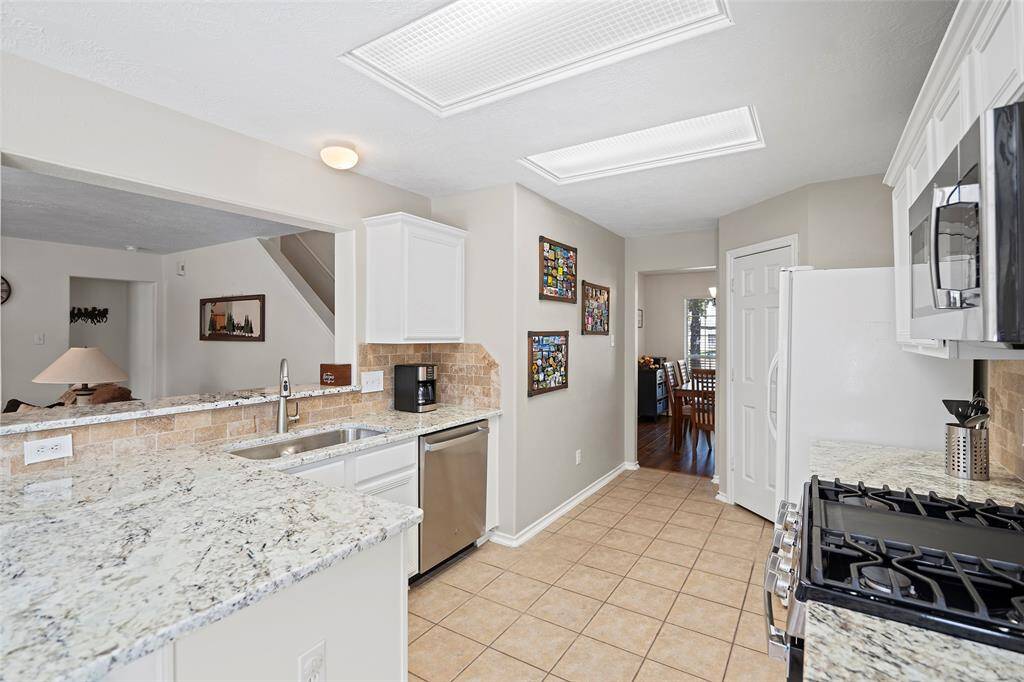There is ample space for meal preparation and a large breakfast bar to sit and enjoy a glass of wine while a meal is being prepared!