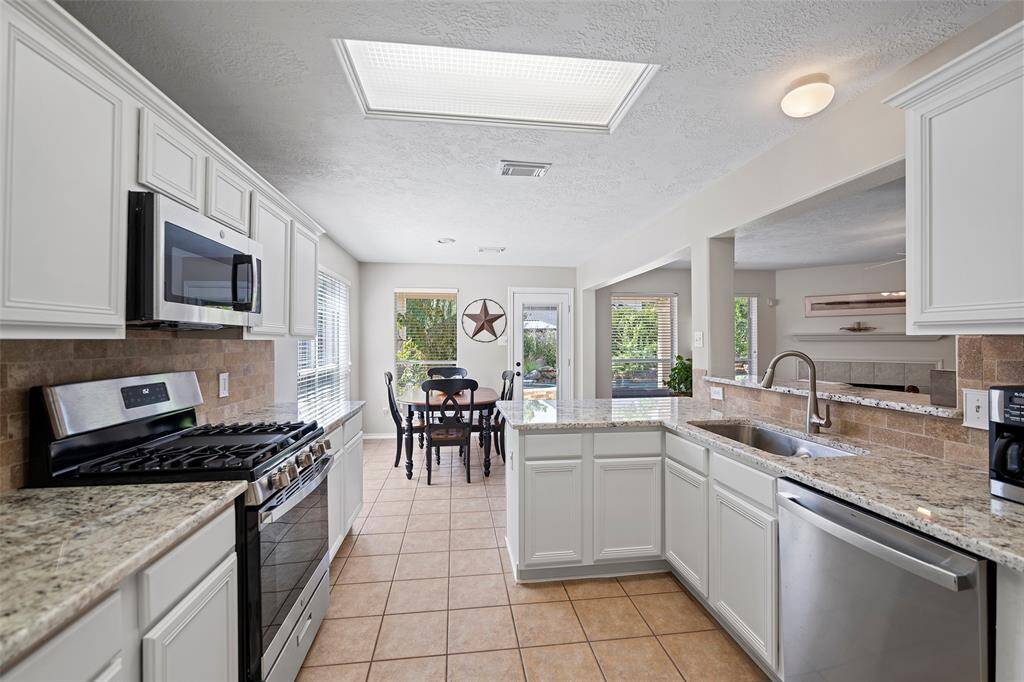 Recent stainless appliances including a gas range!  And take a look at that oversized sink!