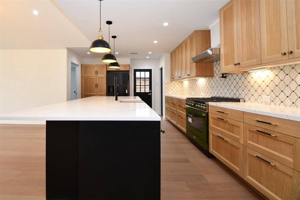 Pantry, the refrigerator and the laundry room are located just at the end of the kitchen.