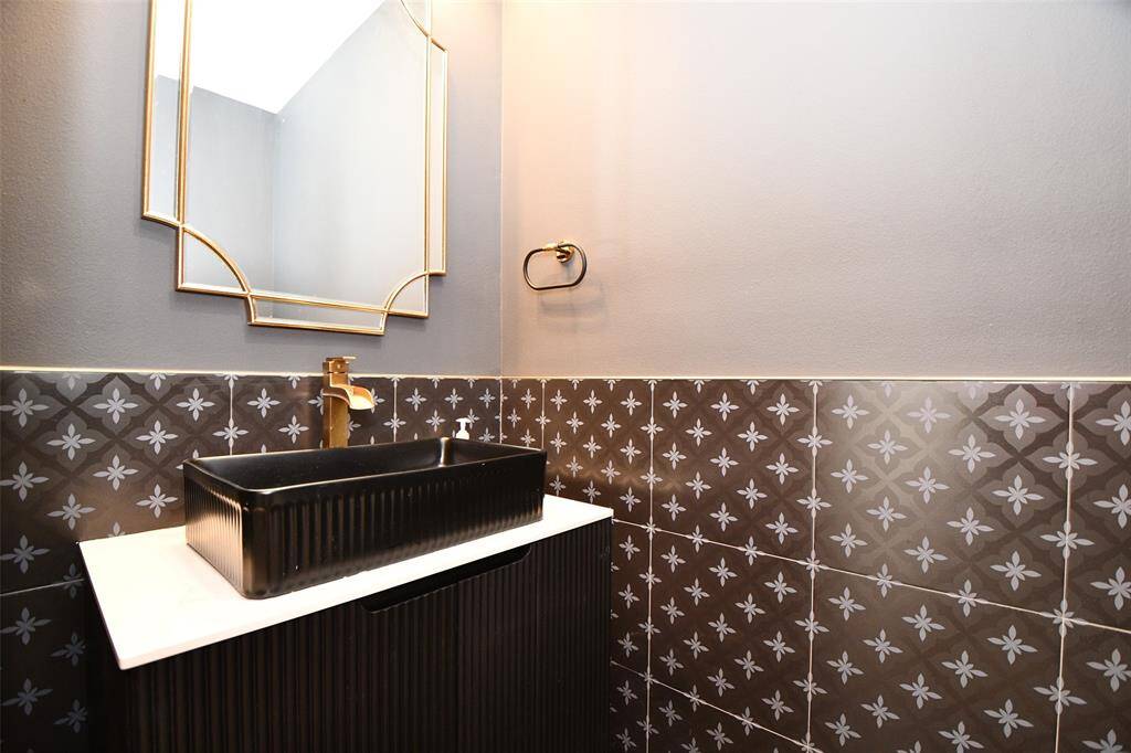 Elegant powder room conveniently located for your guests.
