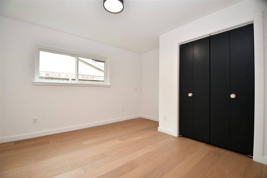 The middle bedroom has a cut out perfect for a desk or upright dresser plus a double wide closet.