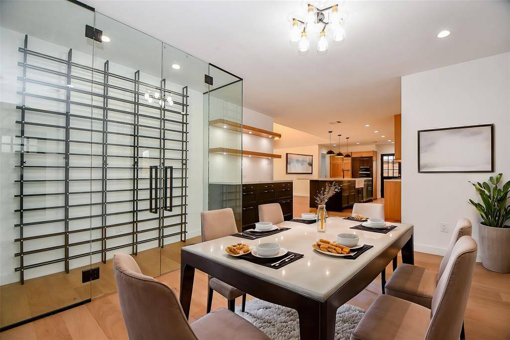 This area is just off the entry and its crowing jewel is the 80 bottle wine rack and dry bar. The space itself could serve as a formal dining space or a wine tasting area.