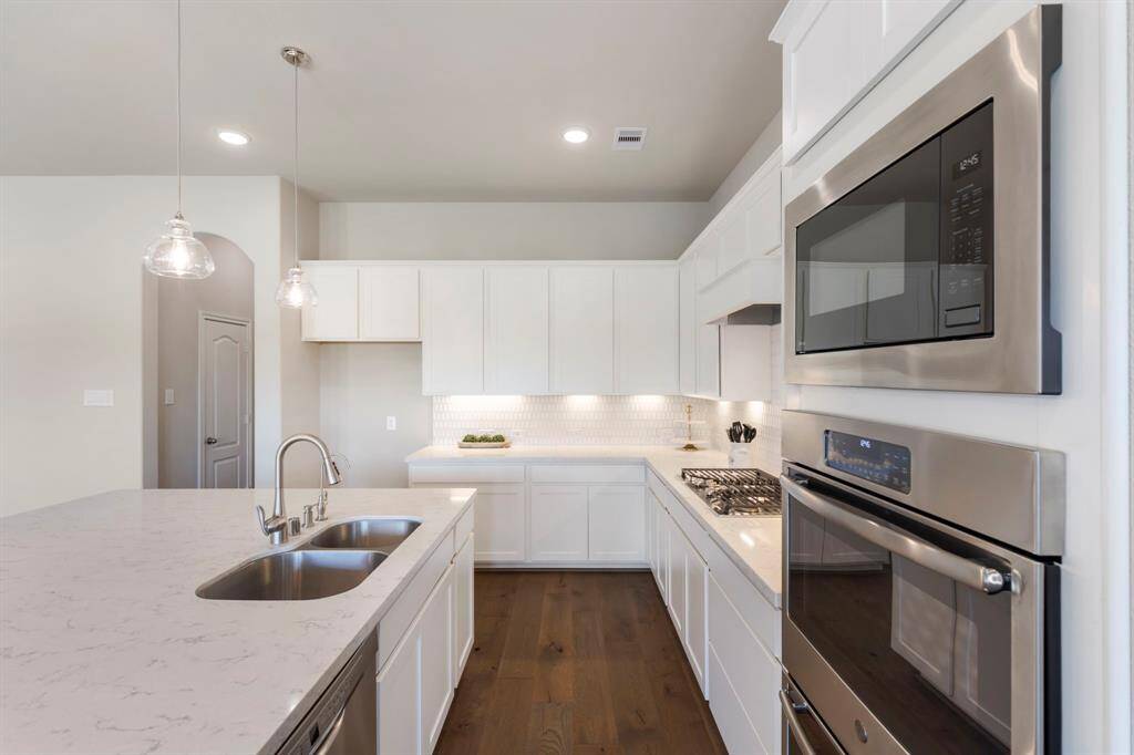 Wood flooring, water filtration at sink, and pass-through to walk-in Pantry and Butler Pantry!