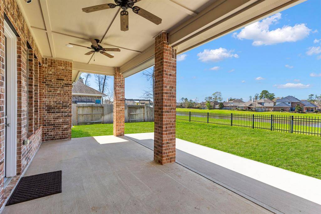 Large covered back patio accommodates both a sitting and dining area! Spectacular views of the community lake and fountains!