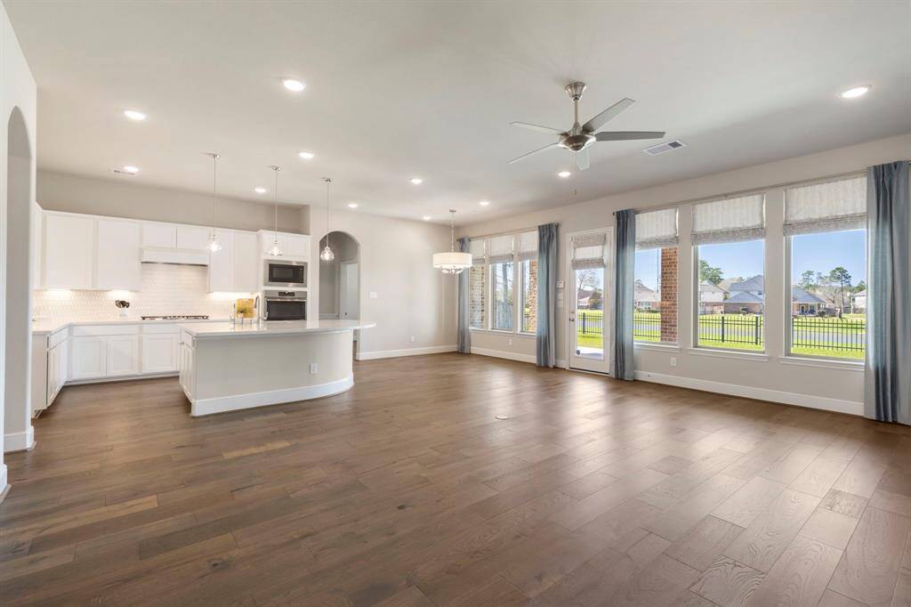 What an incredible space to gather with family and friends! This home boasts a stunning open floor plan with an abundance of windows, offering breathtaking lake views and tons of natural light!