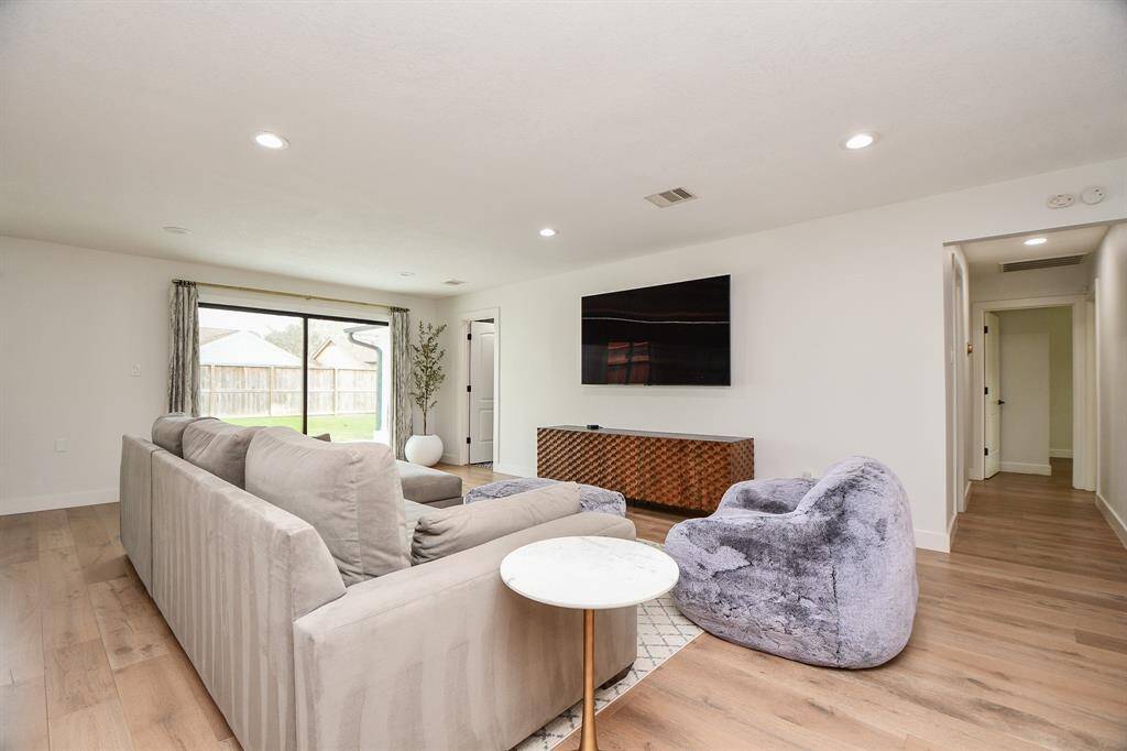 Elegant and airy living space with abundant natural light, perfect for relaxation and entertainment.