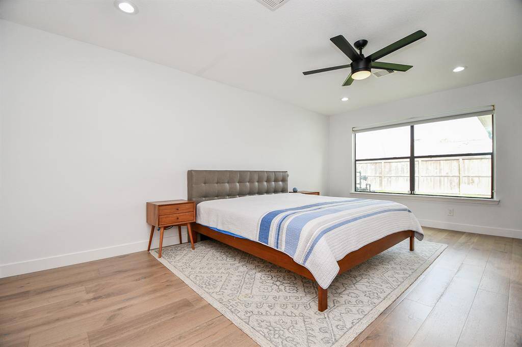 Spacious primary suite with abundant natural light and modern finishes.
