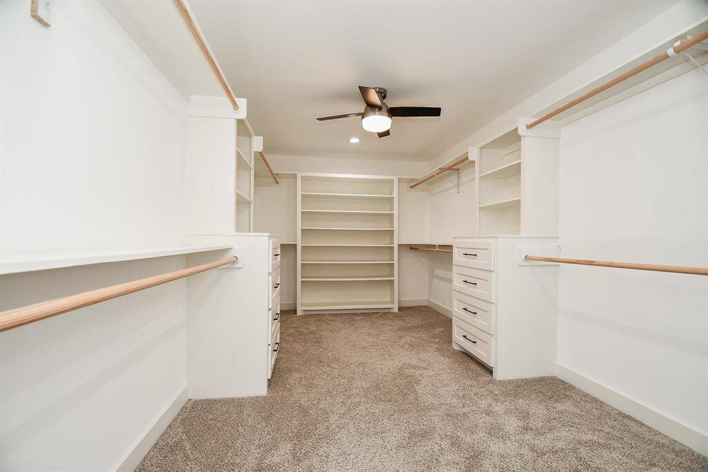 Spacious walk-in closet with ample storage.