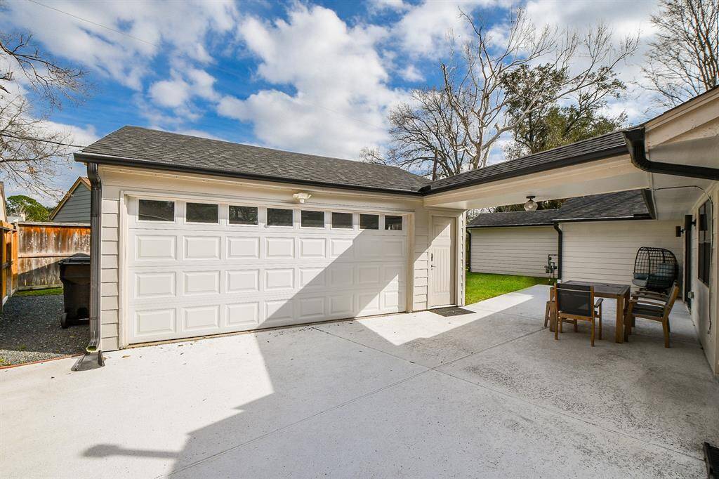 Spacious garage with ample storage, modern doors, and easy backyard access—ideal for convenience and versatility.
