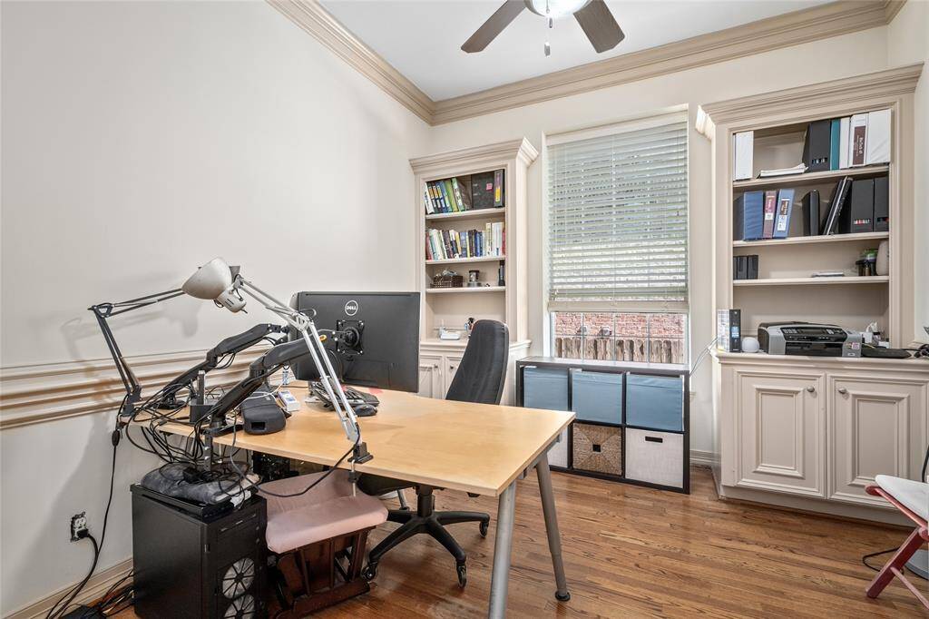 This dedicated office space boasts built-ins and a set of double-doors (not shown here) when privacy and quiet is needed.  This smart home controls thermostats, security and switches!