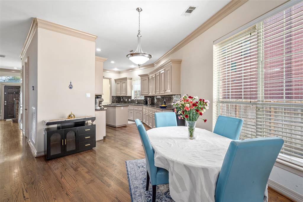 This view highlights the openness from den to breakfast and to kithcen.  Great flow for entertaining.
