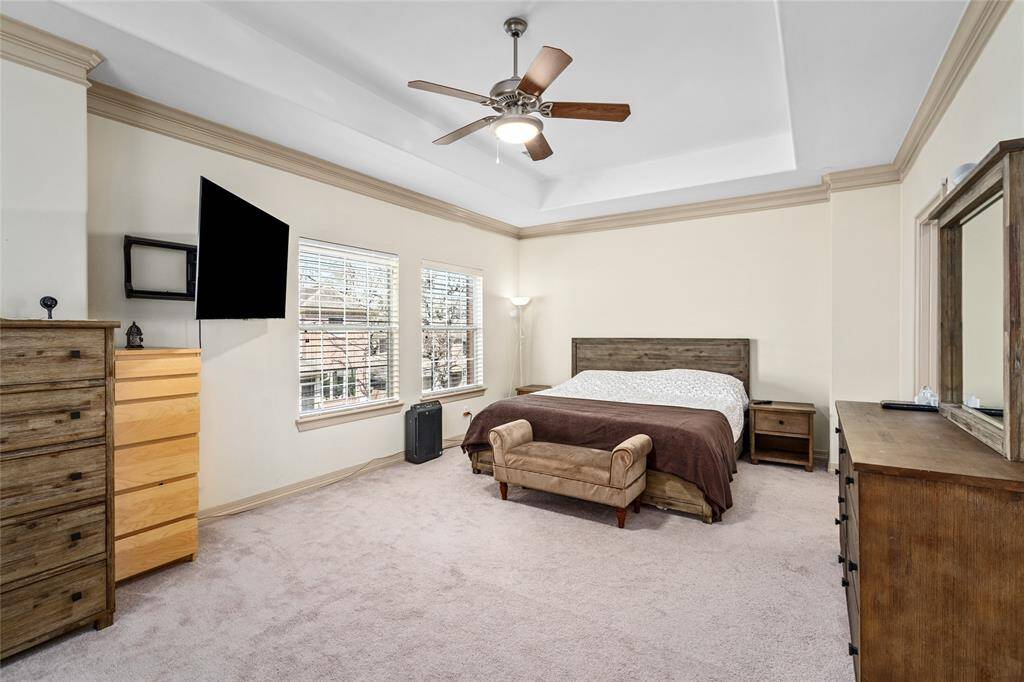Elegant and sizable, this primary bedroom can accomodate a sitting room, exercise equipment, library and more.