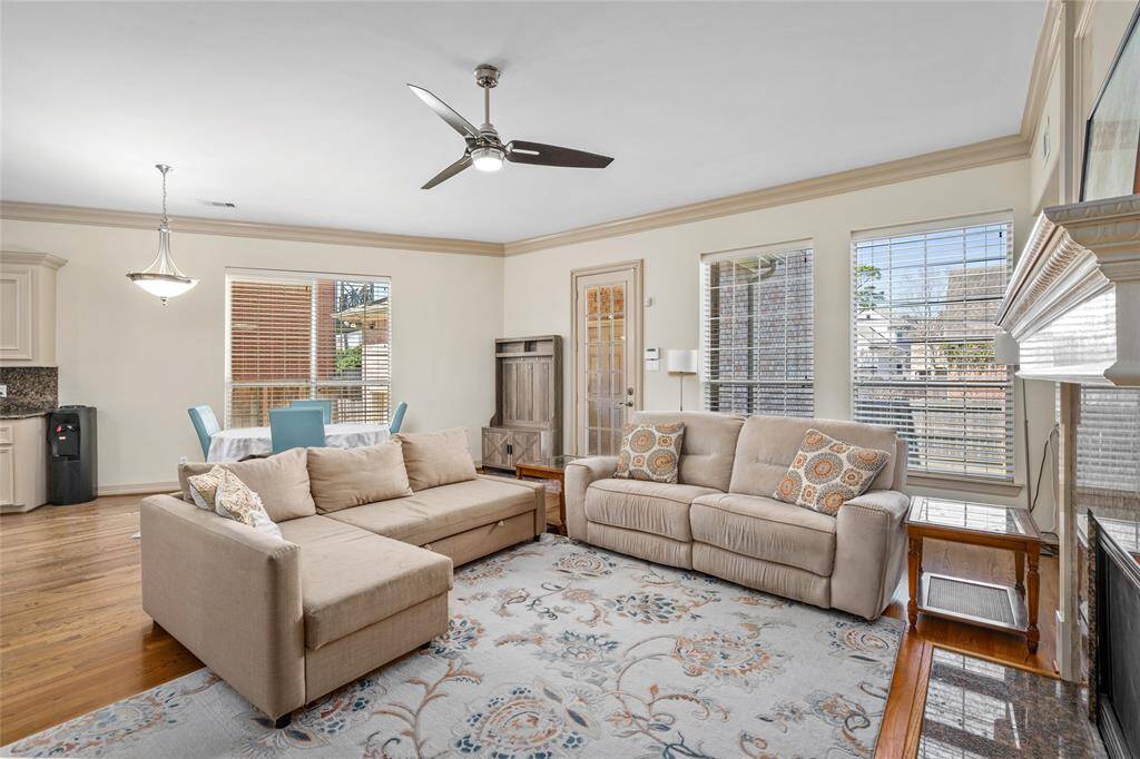 Note the abundant windows and light-filled room.  The door leads to the garage and apartment, which is just a few steps across a bricked porch.