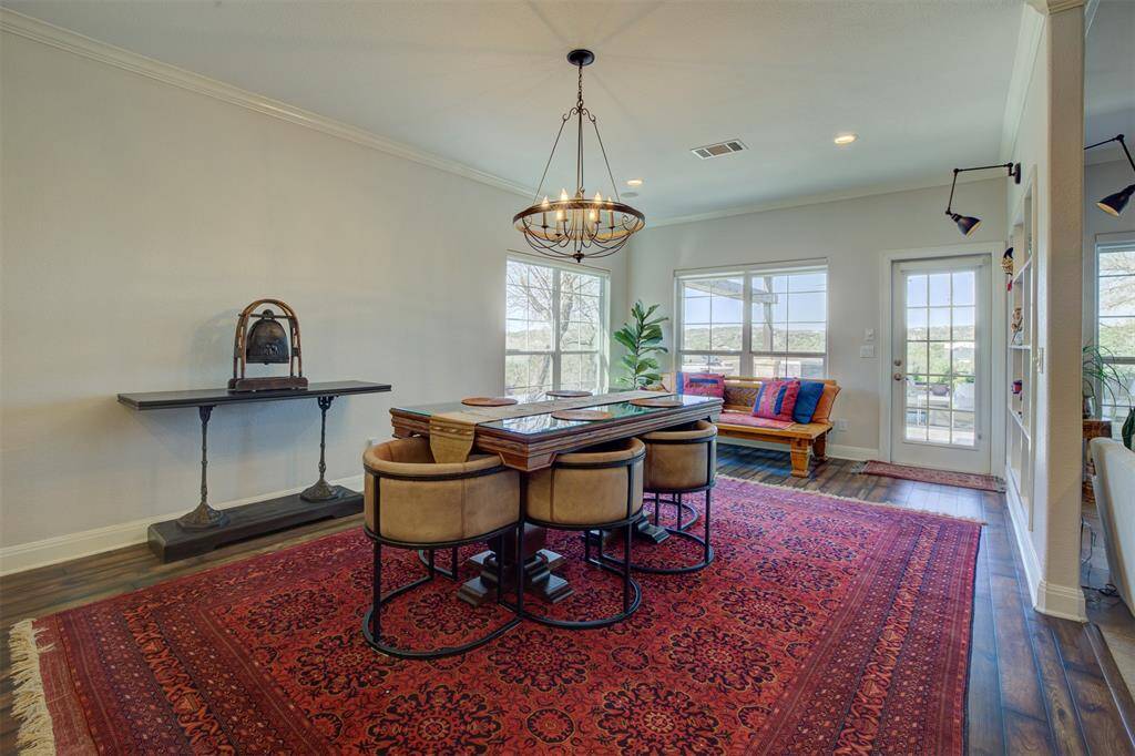 Spacious well lit dining room can accommodate large extended table.