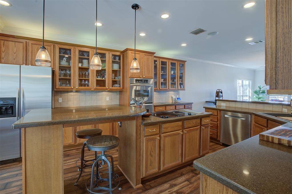 Beautiful oak cabinets with extended counter space and granite countertops.