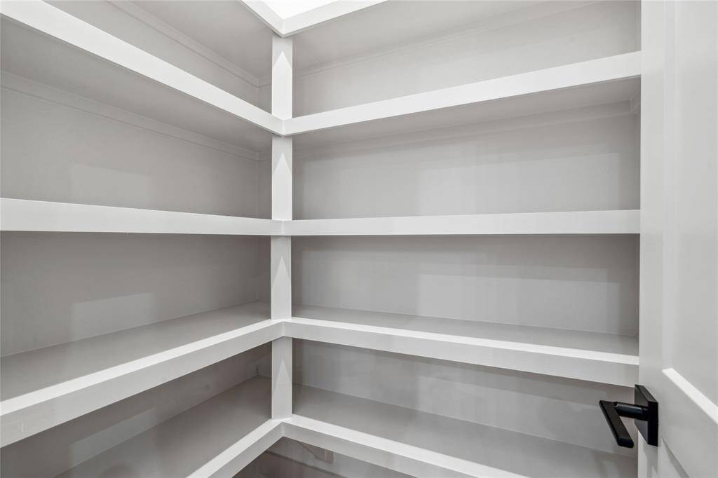 The large pantry with perfect built-in's makes kitchen organization a breeze.