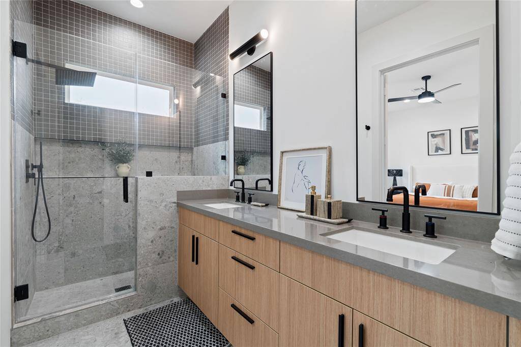 Step into your primary bathroom, a serene retreat designed for ultimate relaxation and tranquility after a long day.