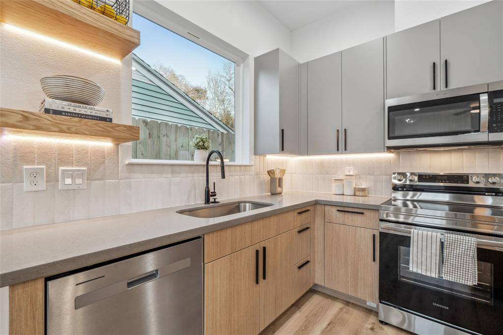The kitchen area has a large picture window that allow plenty of natural light.