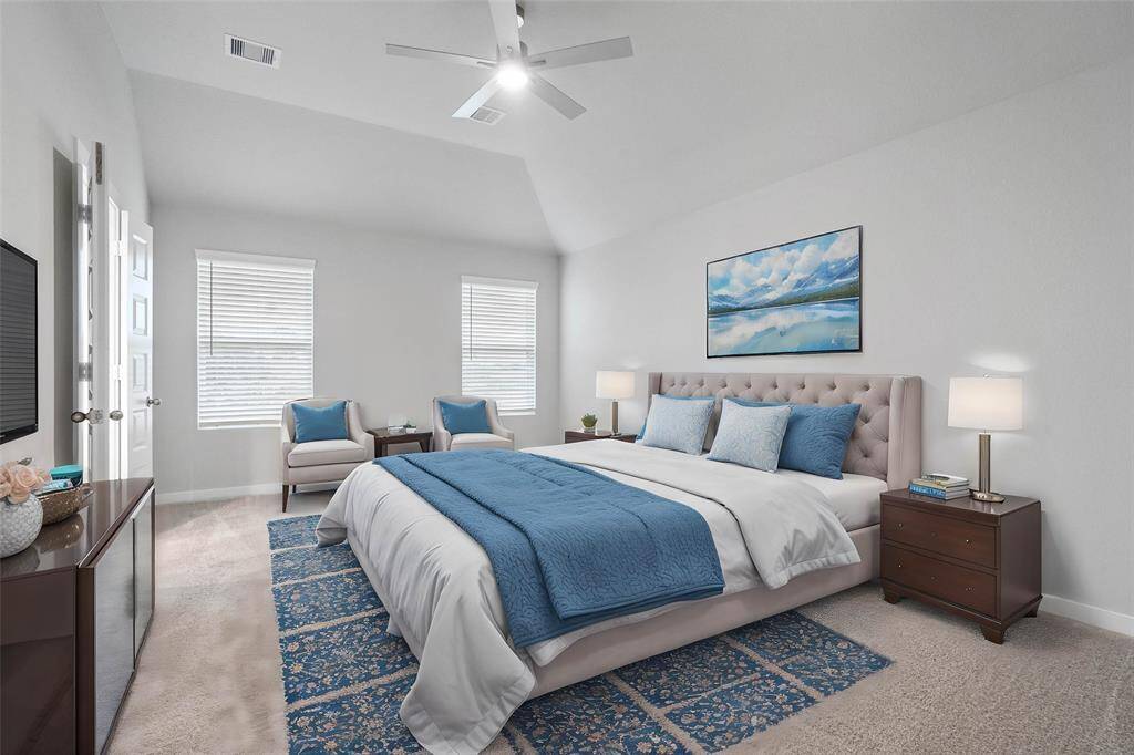 Come and unwind after a long day in this magnificent primary suite! This spacious room features plush carpet, warm paint, high ceilings with ceiling fan, and large windows with privacy blinds!