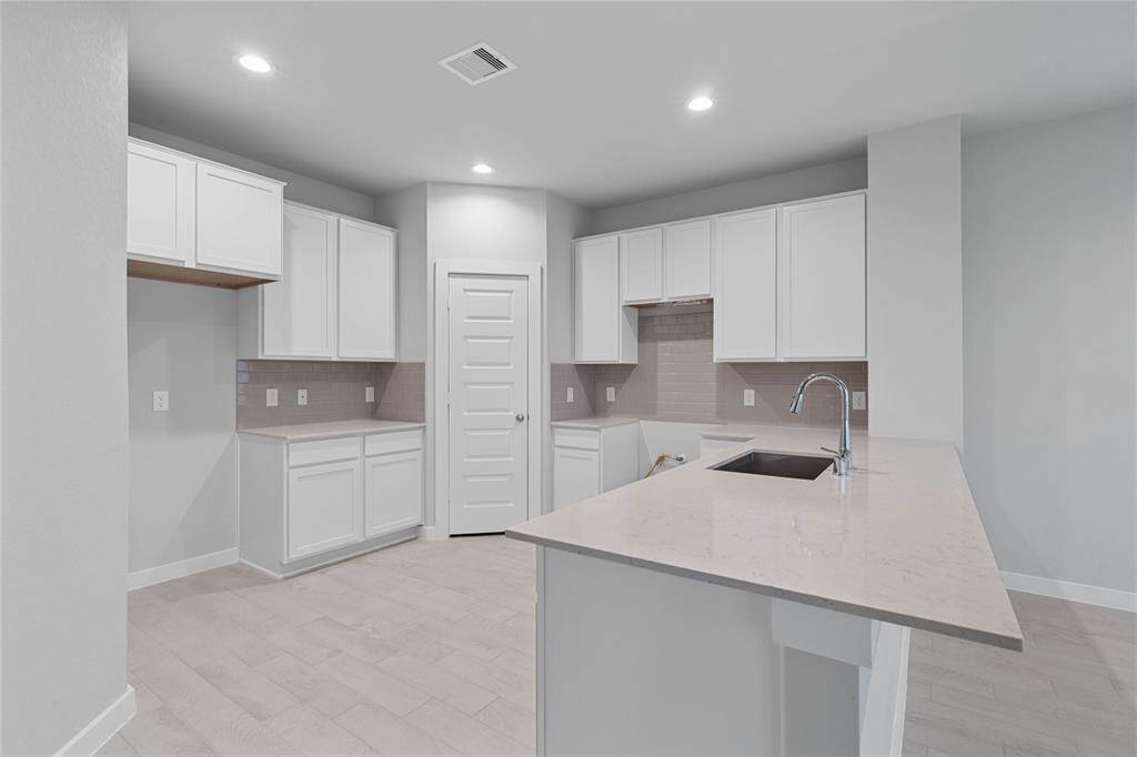 Additional view of this spacious and beautiful kitchen.