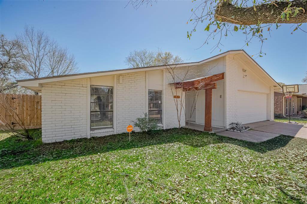 Lovely white brick elevation with covered entryway