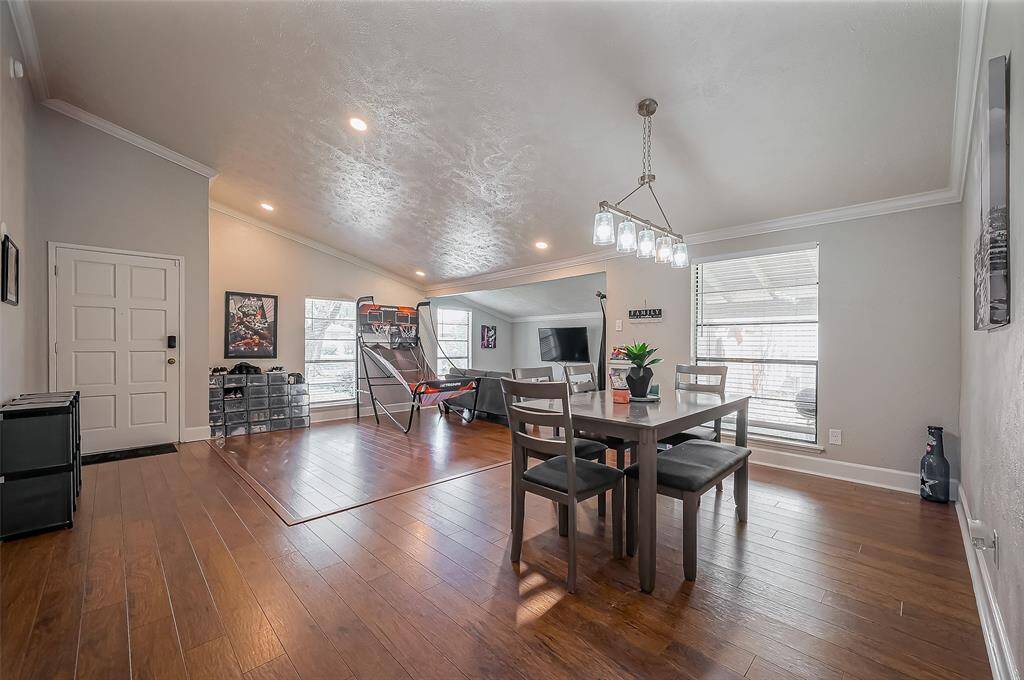 Front door opens to your formal living and dining room with high ceilings lots of natural light